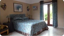 Bedroom three with king bed